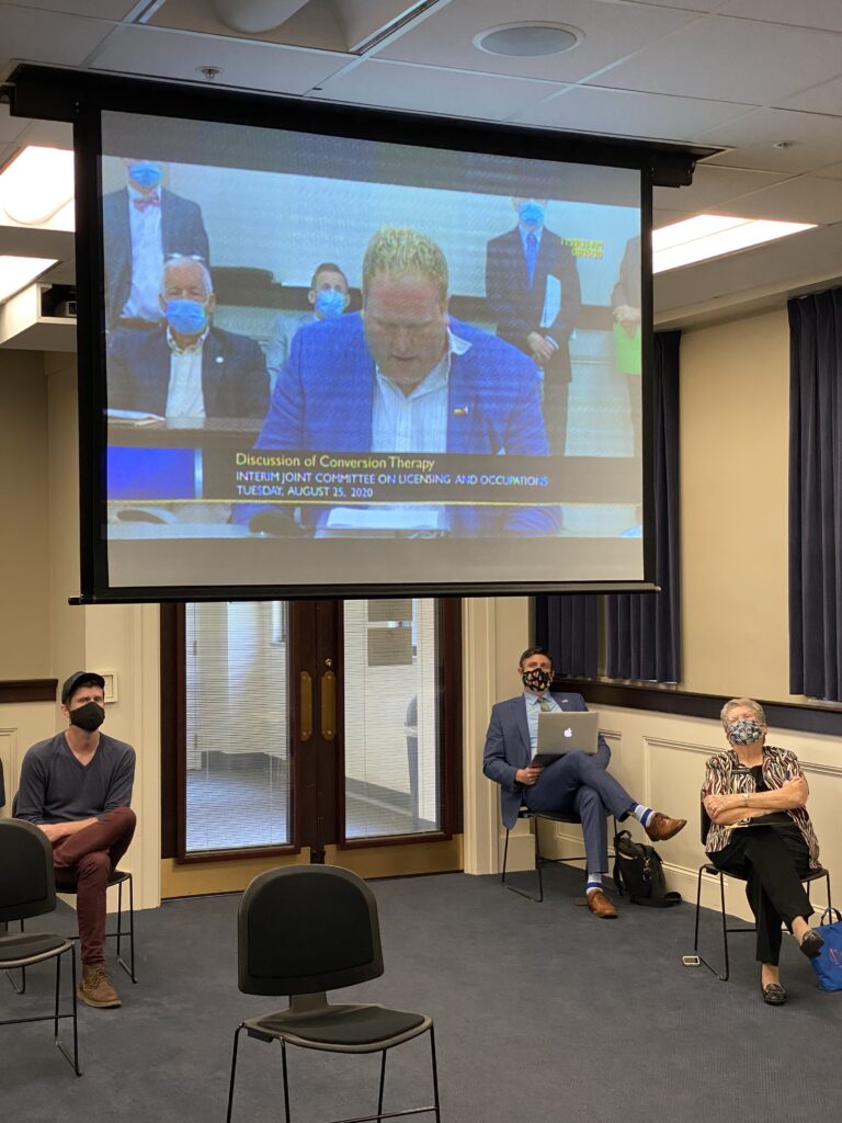 Socially distanced survivors and advocates listen to testimony during Kentucky informational hearing to ban conversion therapy (Credit: Mathew Shurka)