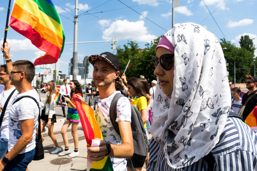 Muslim woman participates in pride festival / Shutterstock